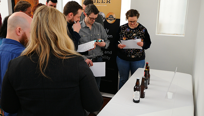 Judges assessing beer packaging at London Beer Competition
